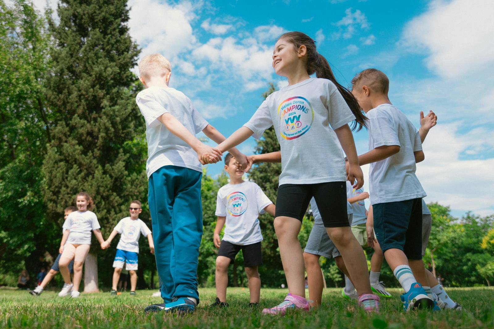Children smiling together during a Kids Kingdom CIC session